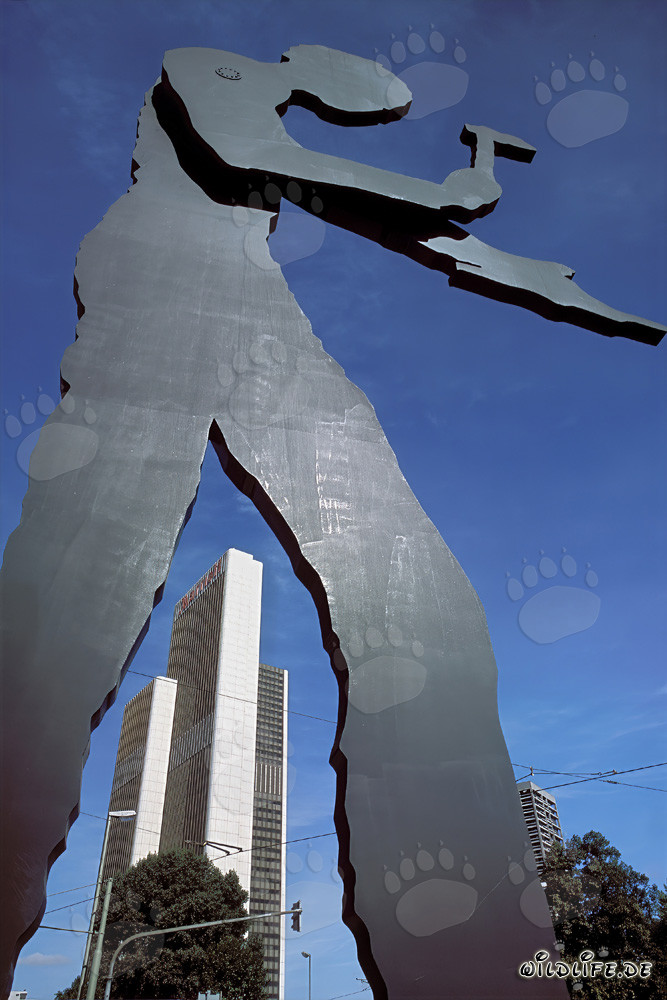 Sculpture of the Hammering Man in front of the Trade Fair Tower in Frankfurt, Hesse, Germany