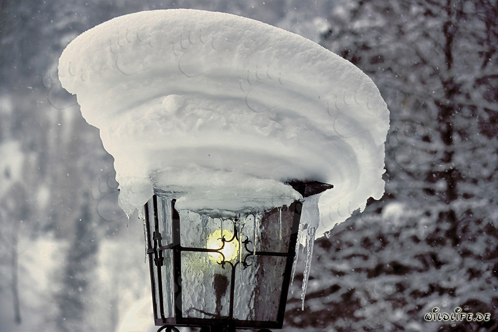 Romantic Winter Atmosphere: Snow-Covered Lamp in Mittenwald