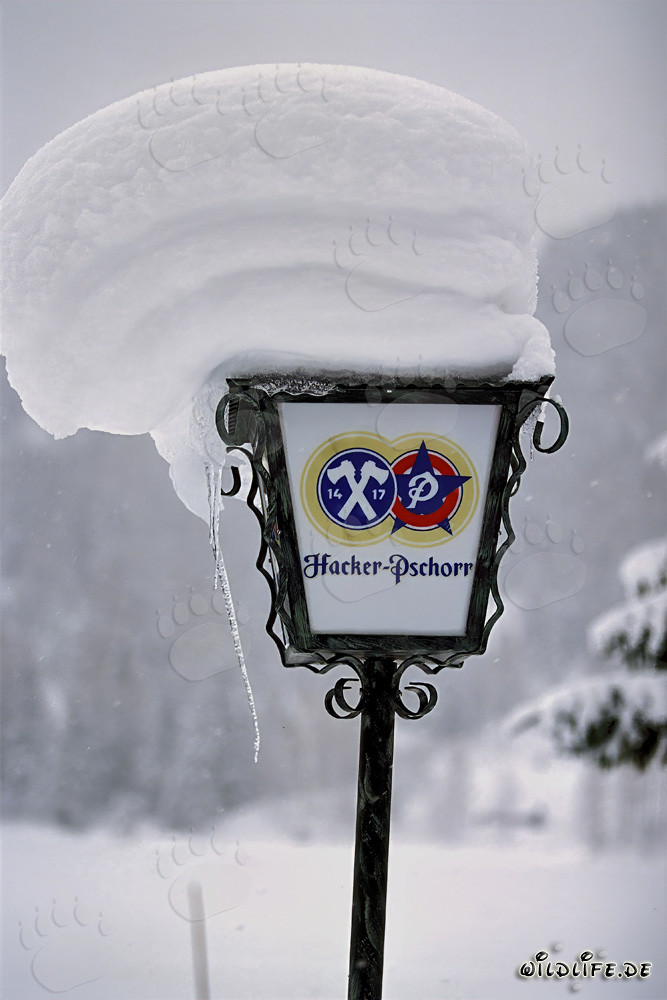 Idyllic winter landscape with snow-covered lamp in Mittenwald, Bavaria